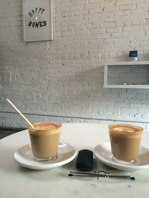 Our flat whites (aka lattes) with Eye Spies, at Happy Bones.